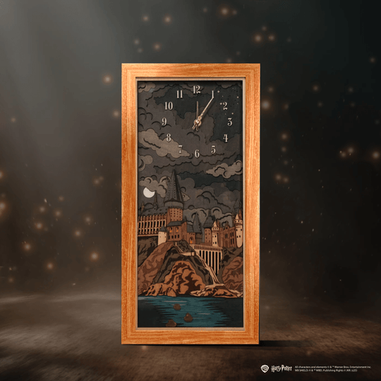 Layered wooden wall art of Hogwarts at night
